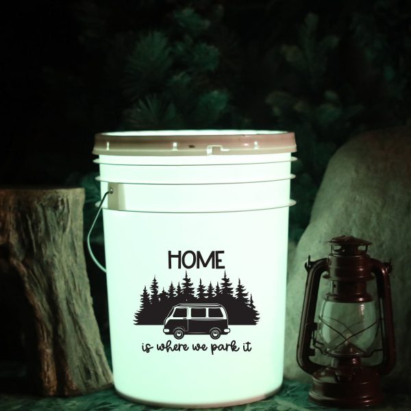 plastic bucket with light inside with a design saying home is where we park it